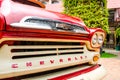 Close up front view of Red classic Chevrolet apache pickup truck for park decoration at Ban Bang Khen.